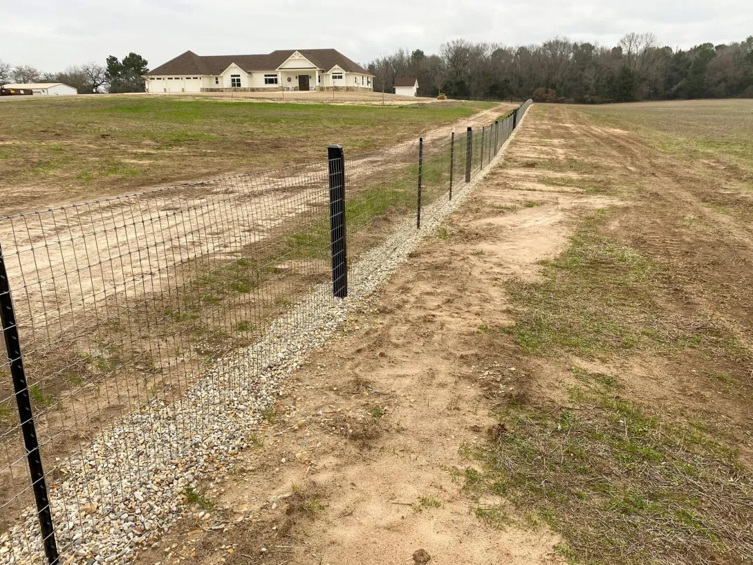 Residential mesh fencing with iron stakes